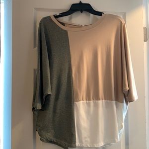 Dolman style relaxed fit shirt. Size small (oversized) fits more like a medium.
